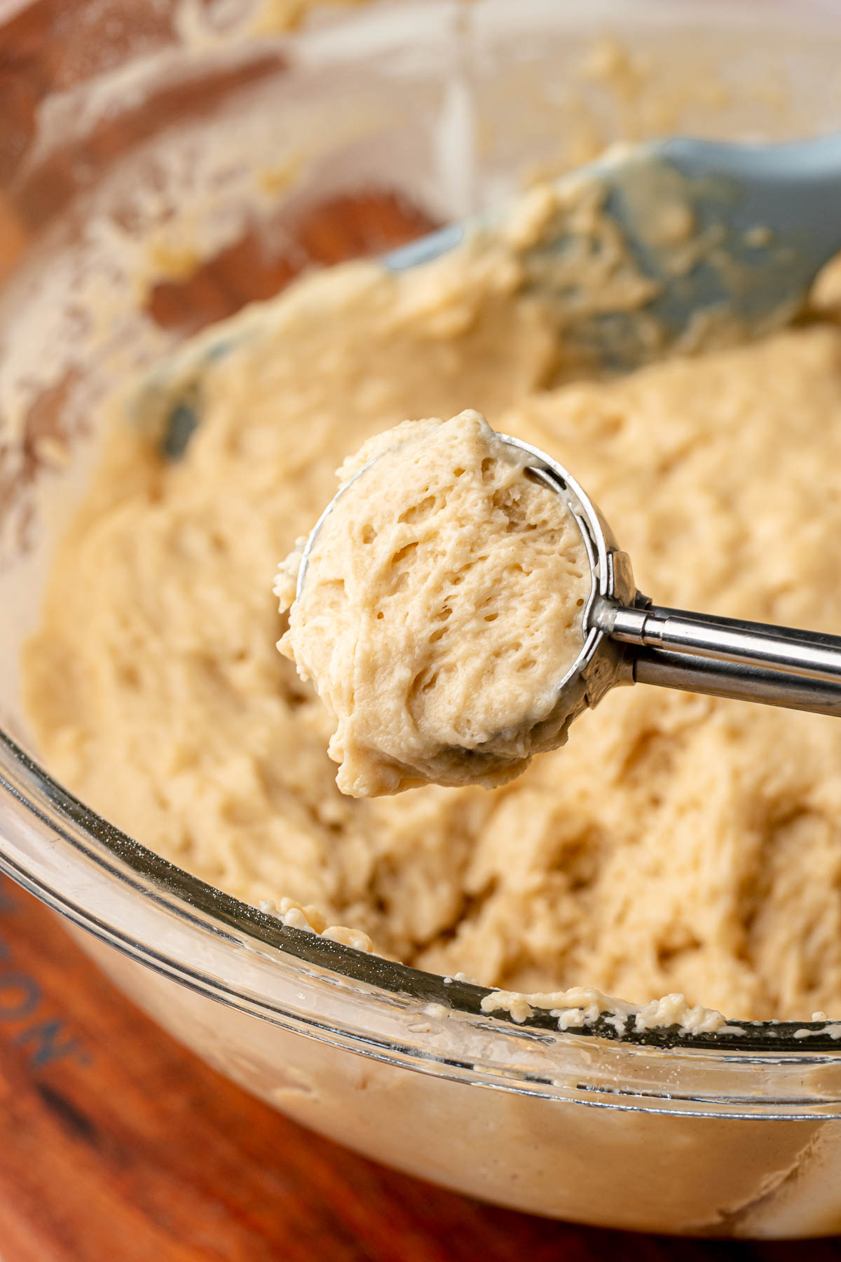 Donut batter in a cookie scoop.