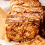 Baked apple fritter pull apart bread with a piece removed.