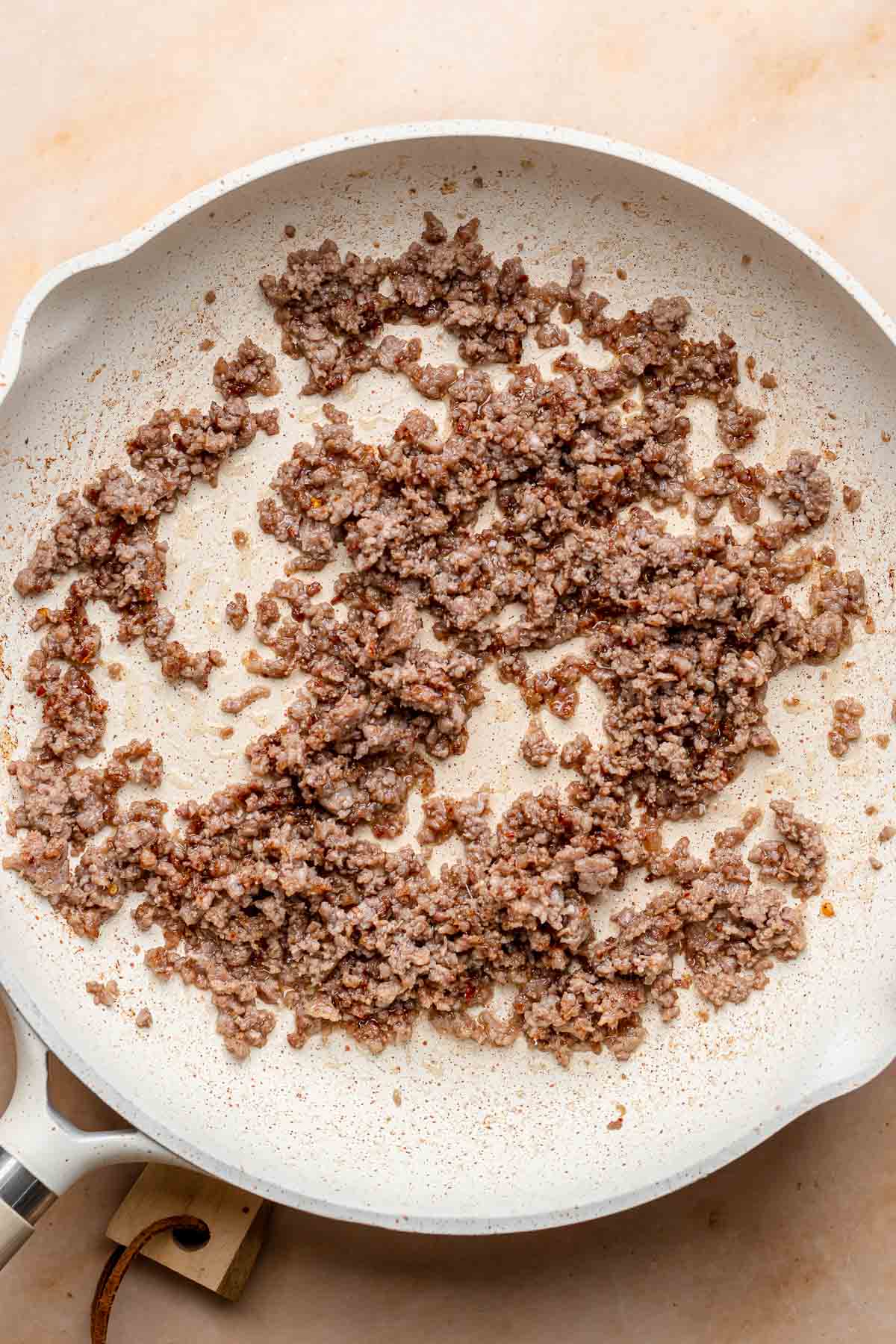 Cooke dground sausage in a pan.