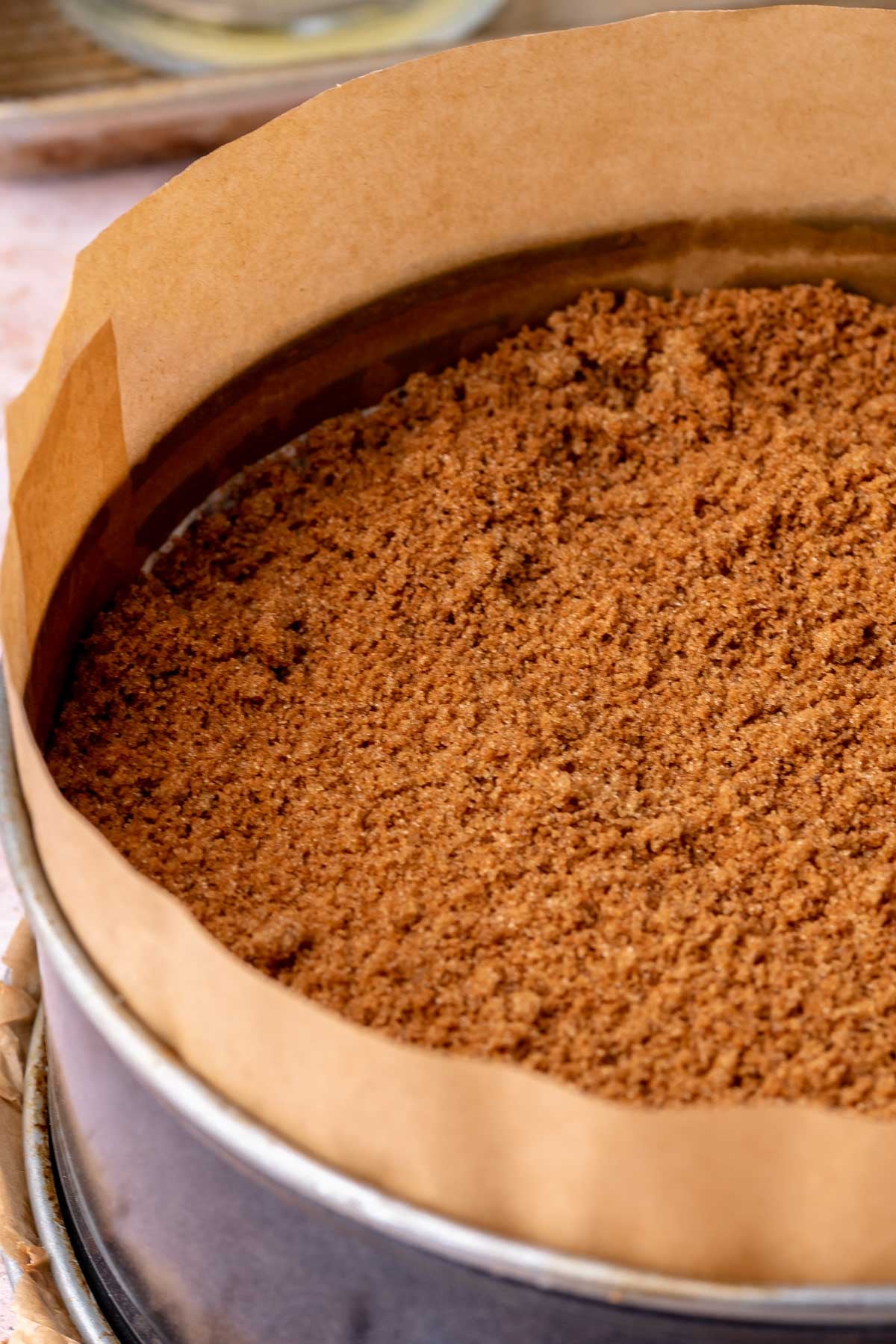 A layer of cinnamon sugar on top of cheesecake.
