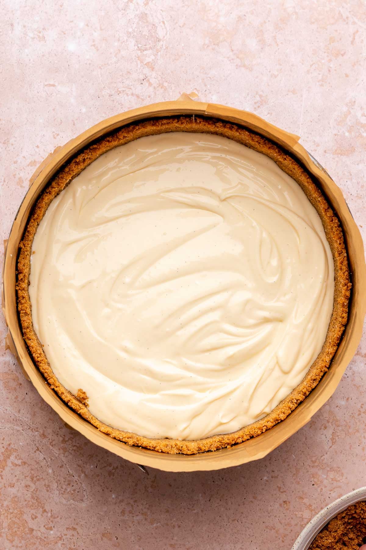Cheesecake batter in graham cracker crust.
