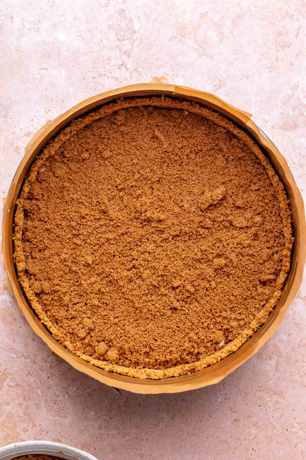 A layer of cinnamon sugar on top of cheesecake.