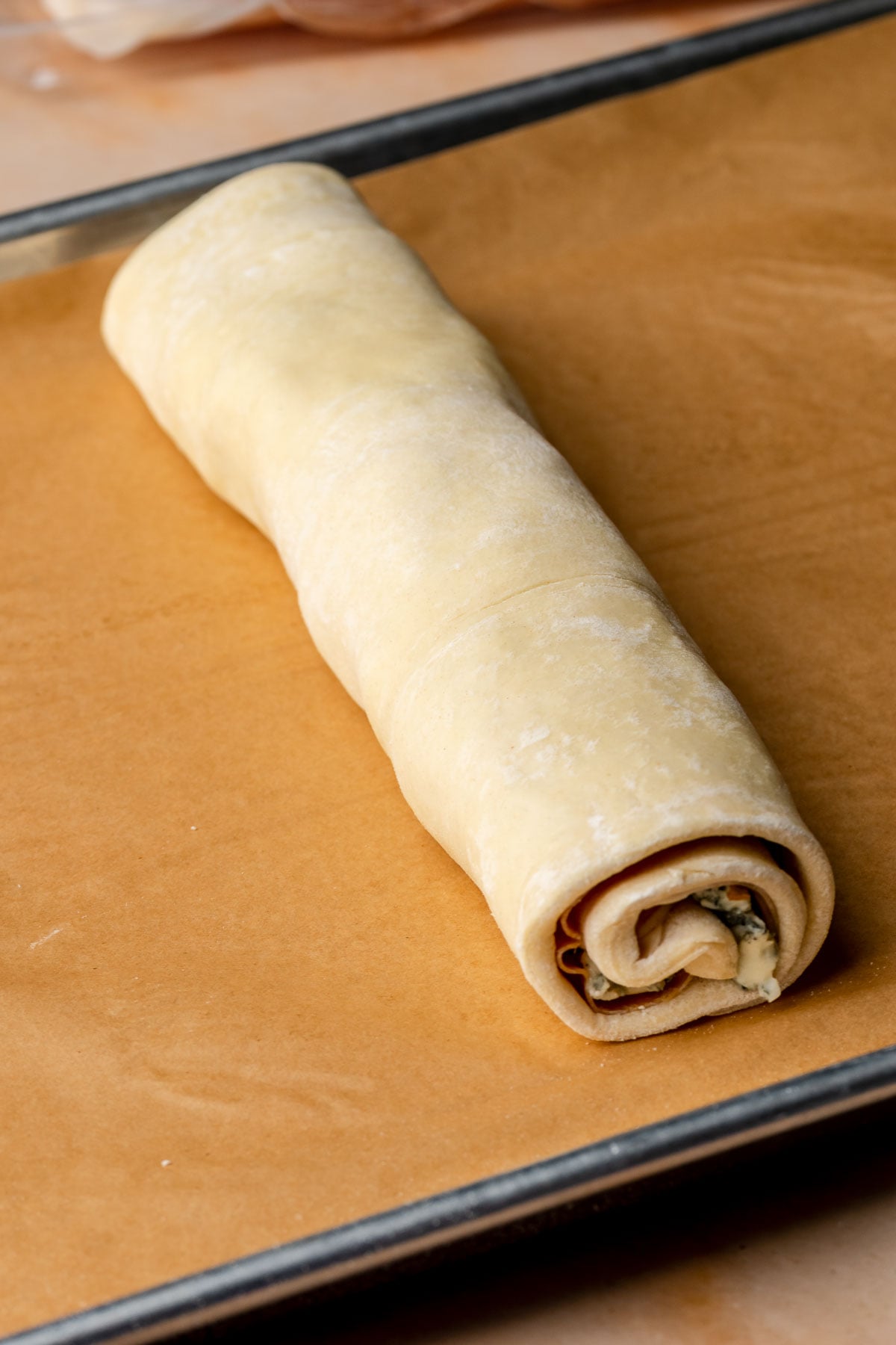 Filled puff pastry rolled into a spiral log.